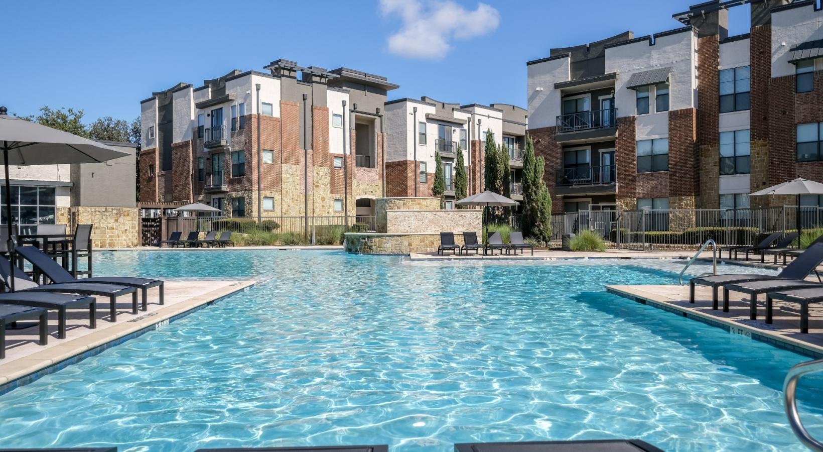 Resort-style swimming pool a swimming pool in a backyard