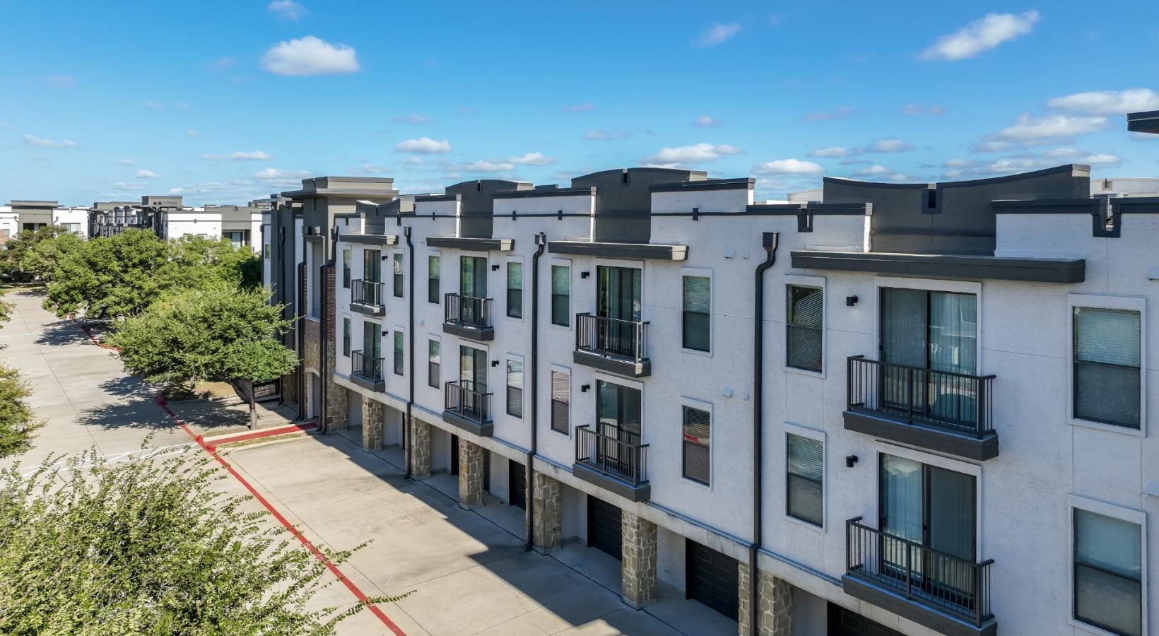 Settle into comfort at Soho Parkway a row of white buildings