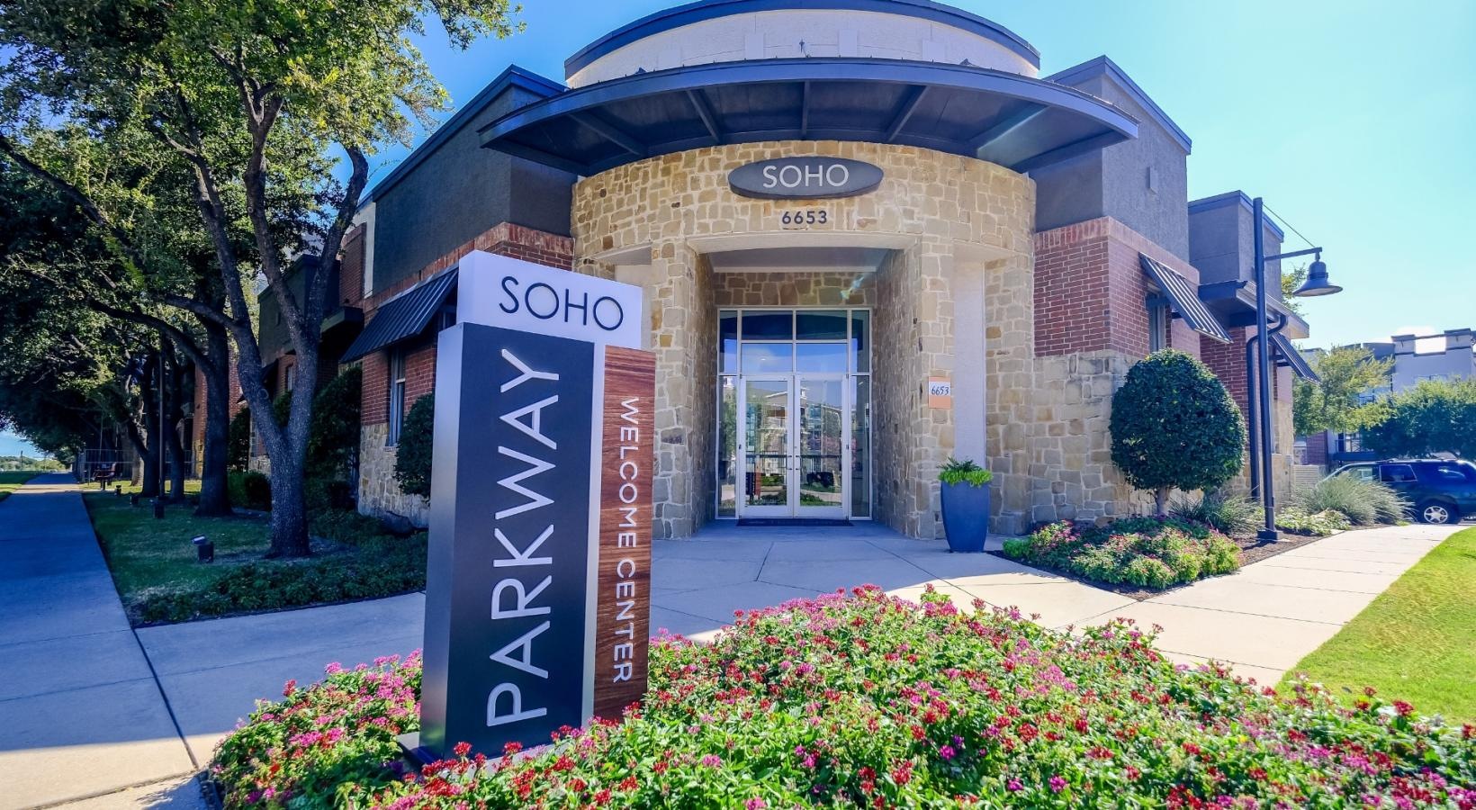 The essence of exceptional living a building with a sign in front of it