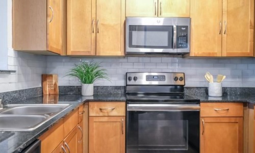a kitchen with black appliances