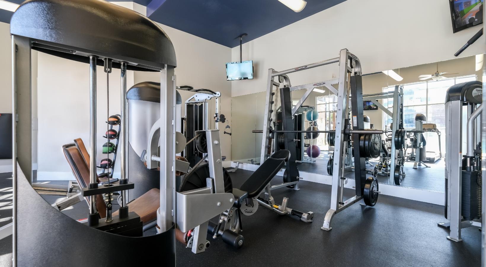 Cutting-edge amenities at your fingertips a gym with exercise equipment