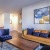 a living room with a couch and chairs