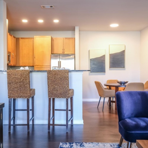 Beautiful living areas to match your lifestyle a room with a table chairs and a couch