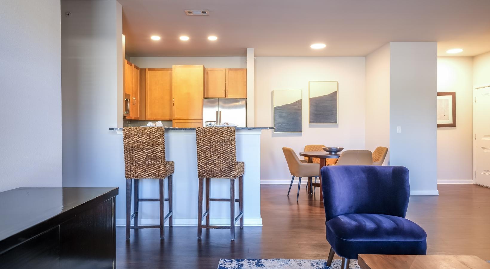 Beautiful living areas to match your lifestyle a room with a table chairs and a couch