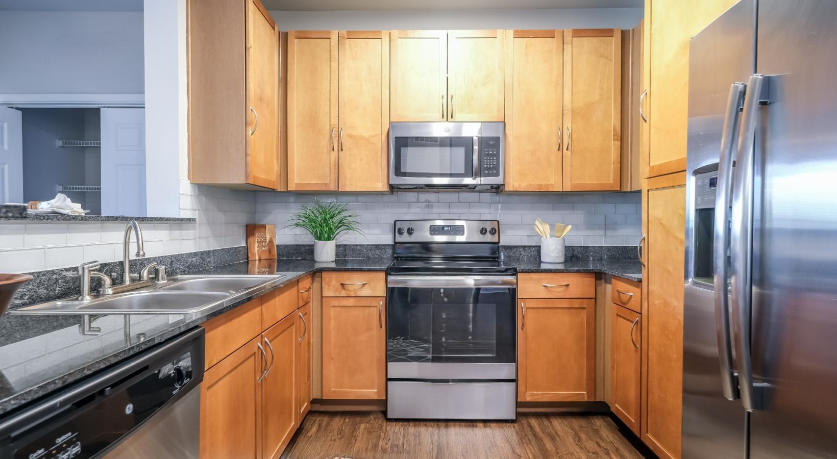 Beautiful kitchens with designer finishes a kitchen with wooden cabinets