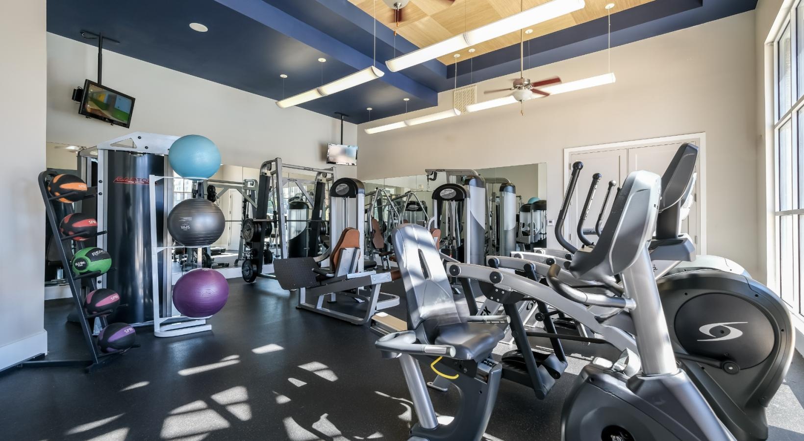 State-of-the-art amenities a gym with exercise equipment