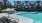 a swimming pool in front of a building