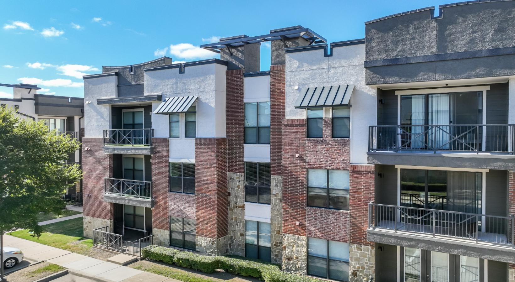 Settle into comfort at Soho Parkway a building with a parking lot