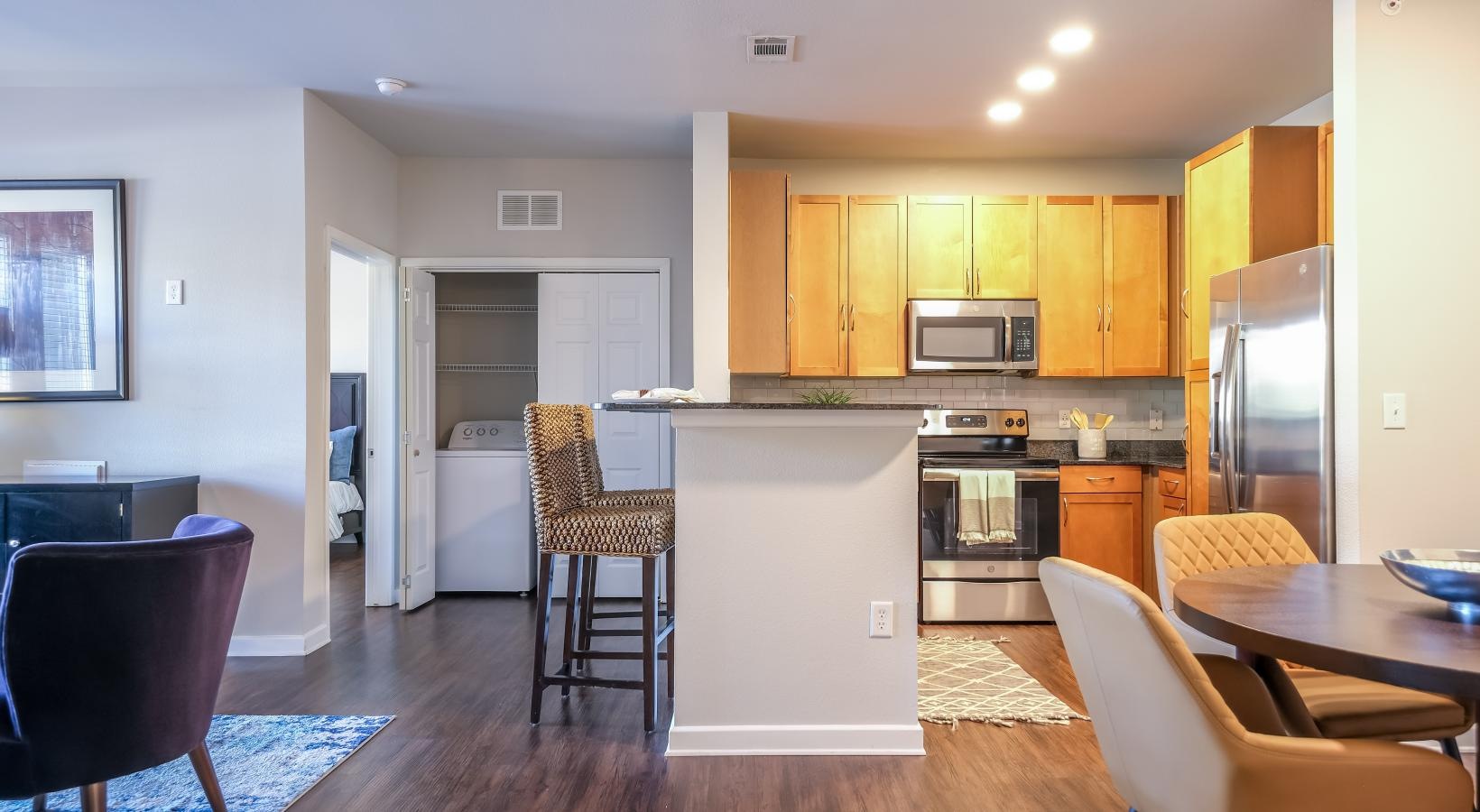 Gorgeous living areas to entertain and enjoy a kitchen with a table and chairs