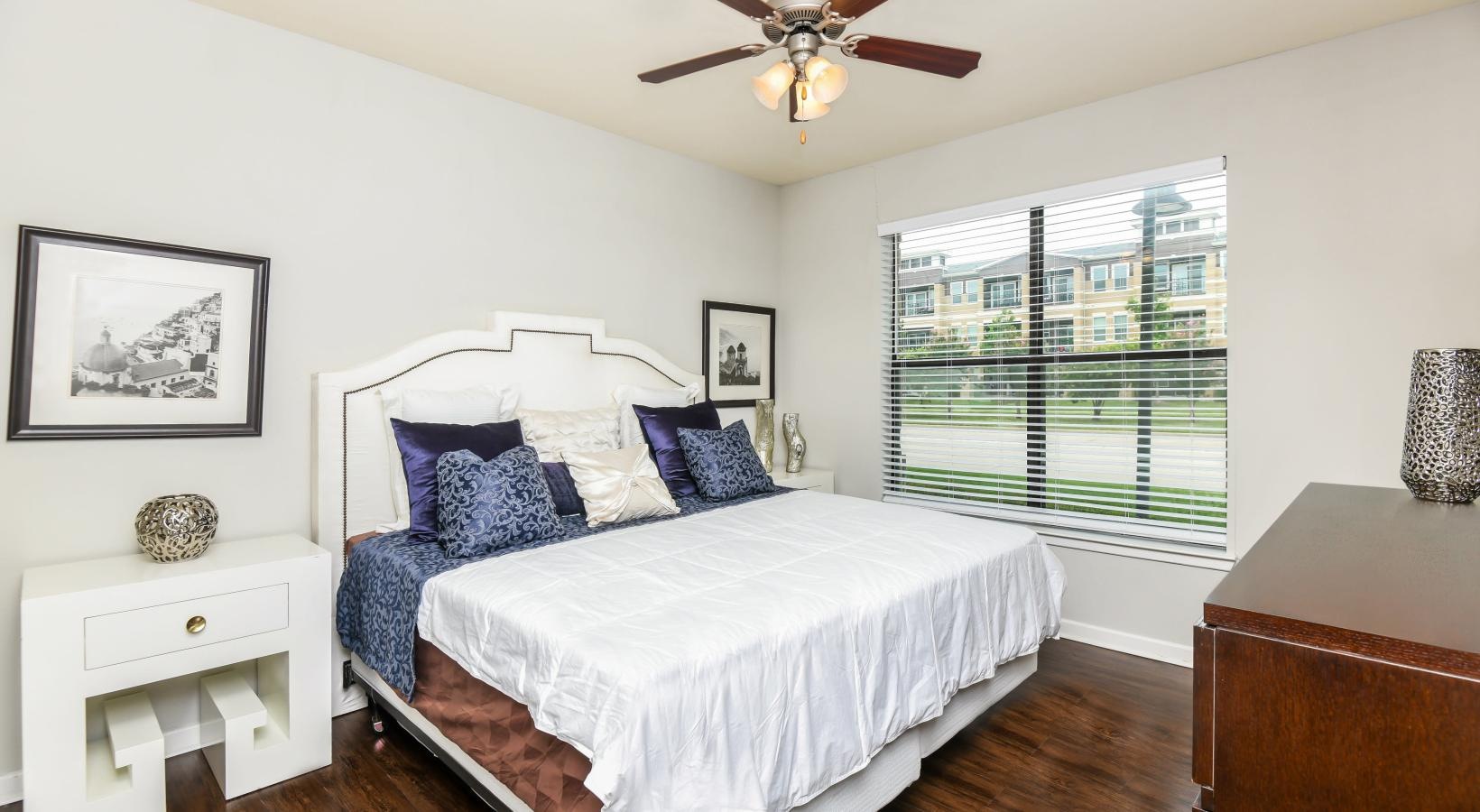 Bedroom options to fit every lifestyle a bedroom with a bed and a fan