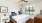 a bedroom with a bed and a fan