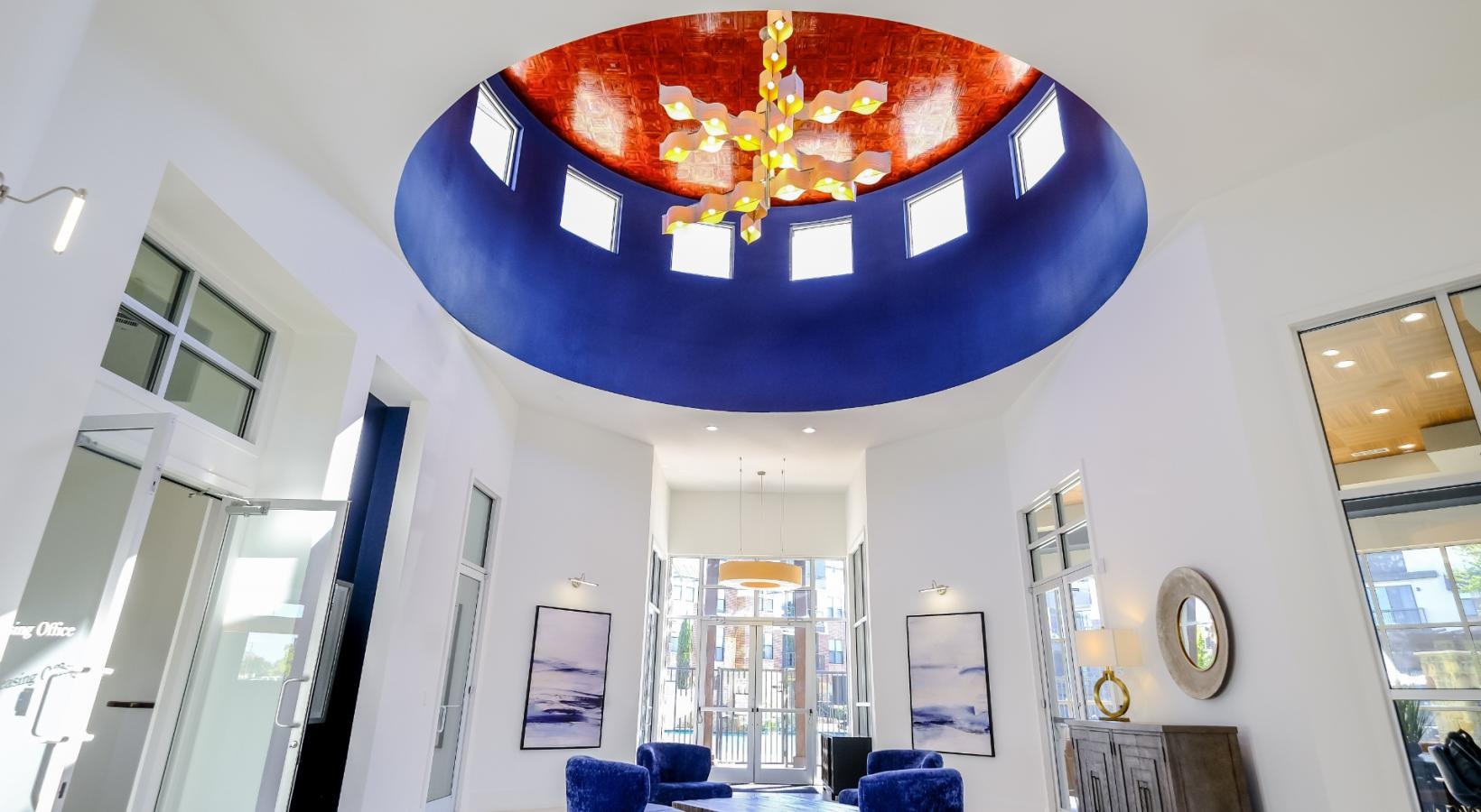 Access to resident-only features a room with a chandelier and chairs